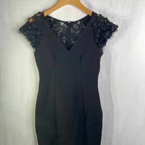Maeve black fitted dress with three dimensional floral, cap sleeves V-neck